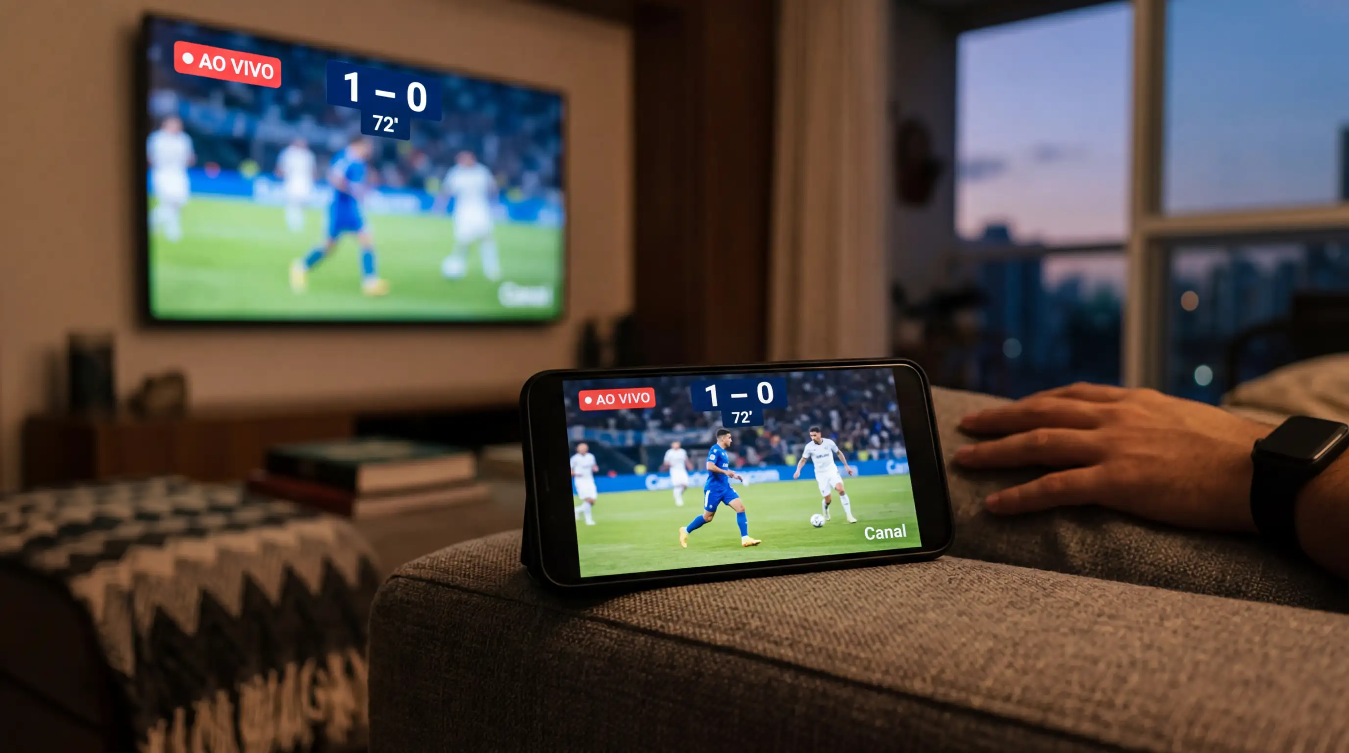 Telemóvel a transmitir um jogo de futebol em direto com a app de apostas aberta